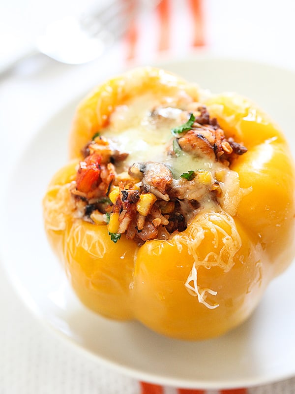 a yellow stuffed bell pepper with hamburger meat filling